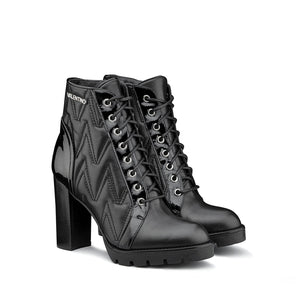 VALENTINO Lace up ankle boots in black faux leather matelassé